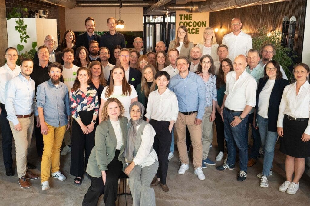 Gruppenfoto des CPC-Teams in einem begrünten Büroraum